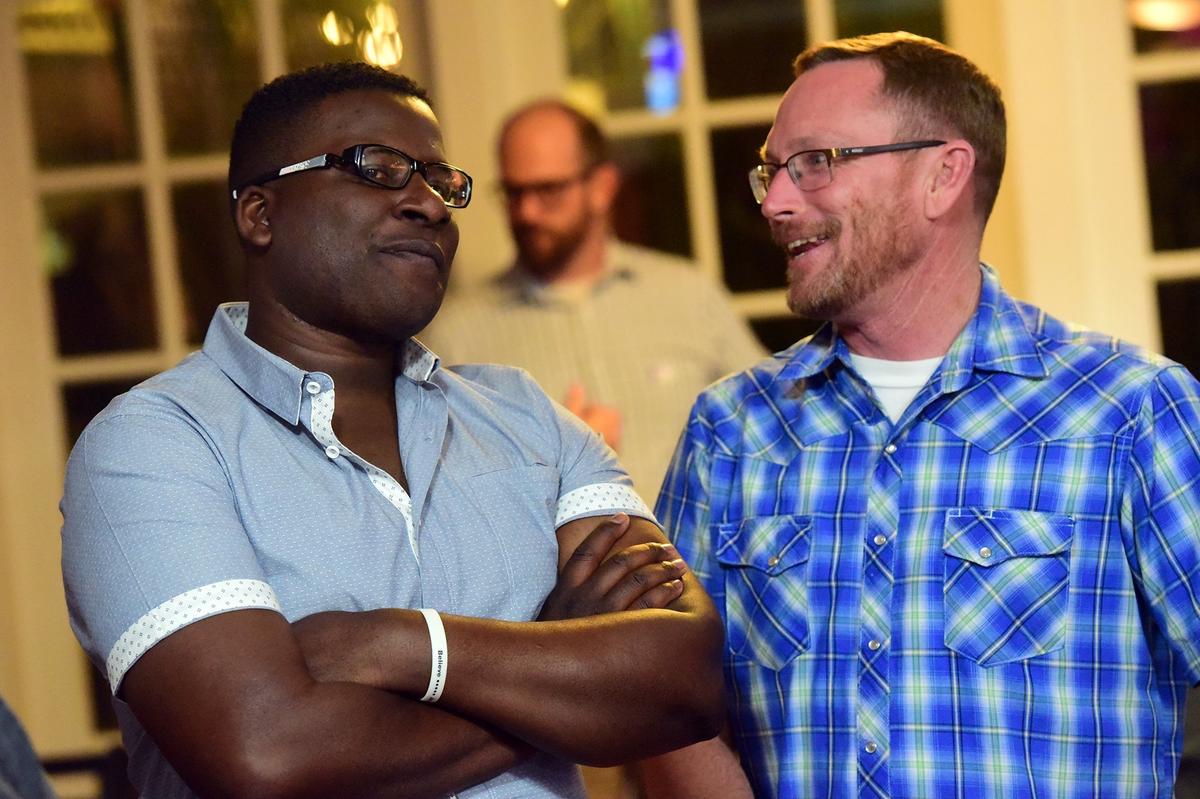 Candidate Delray Shelton, left, a Merced County Sheriff’s sergeant, speaks with supporters in Merced on Tuesday, Nov. 6, 2018. He’s running for District 4.