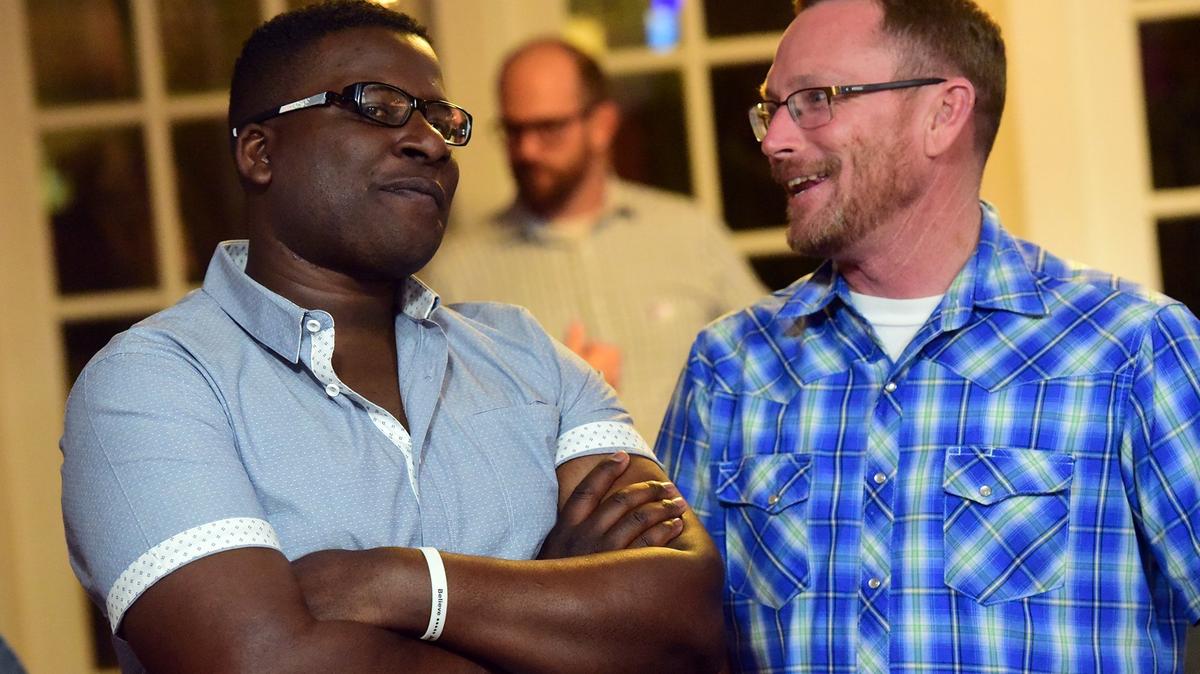 Candidate Delray Shelton, left, a Merced County Sheriff’s sergeant, speaks with supporters in Merced on Tuesday, Nov. 6, 2018. He’s running for District 4.