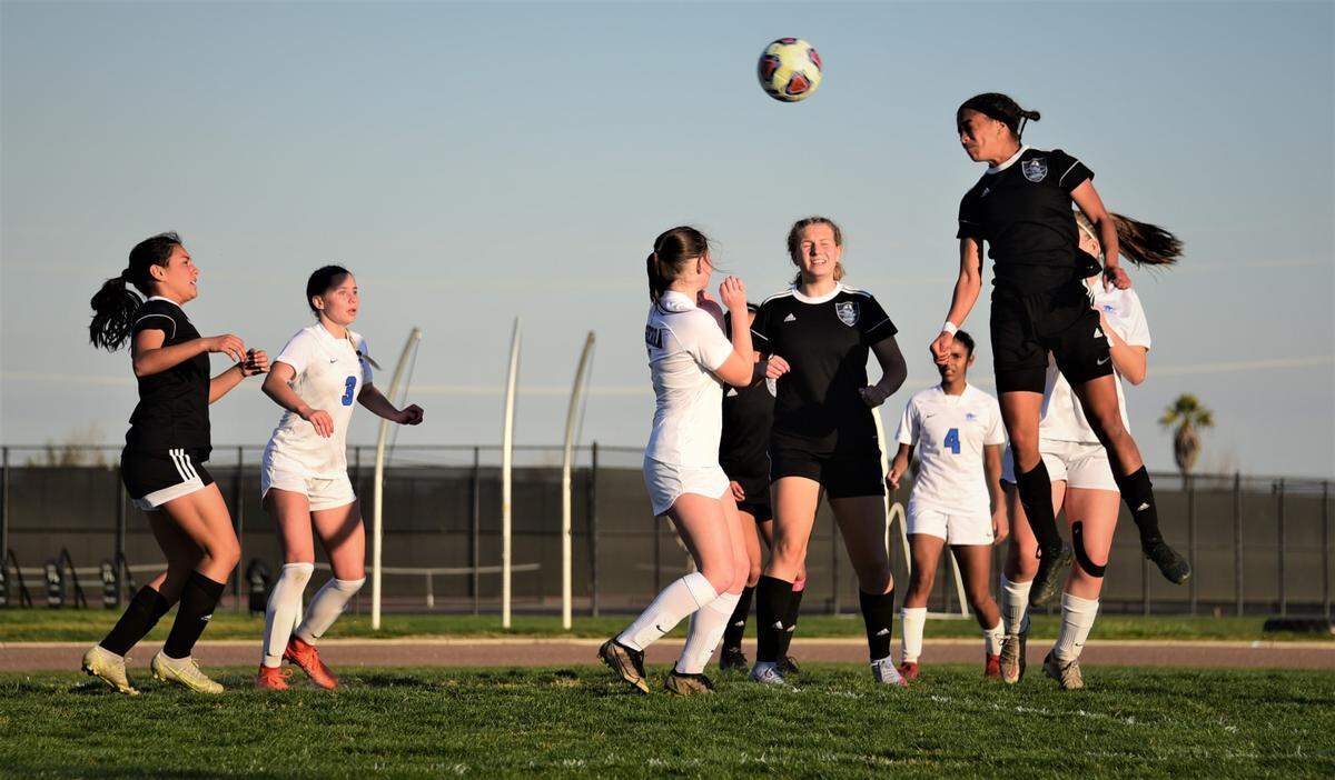 El Capitan High senior Anaya Shelton heads in a goal for her second score in a 3-0 playoff win over Sierra on Wednesday, Feb. 16, 2022 at El Capitan High School in Merced, Calif.