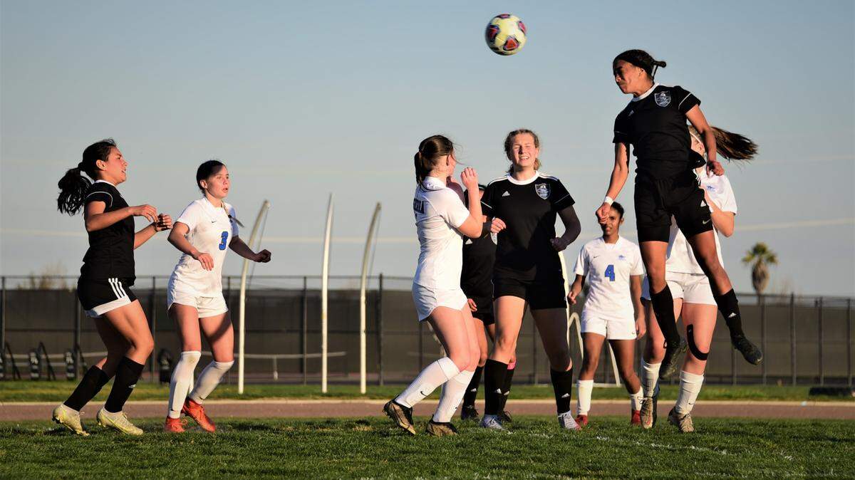 El Capitan High senior Anaya Shelton heads in a goal for her second score in a 3-0 playoff win over Sierra on Wednesday, Feb. 16, 2022 at El Capitan High School in Merced, Calif.