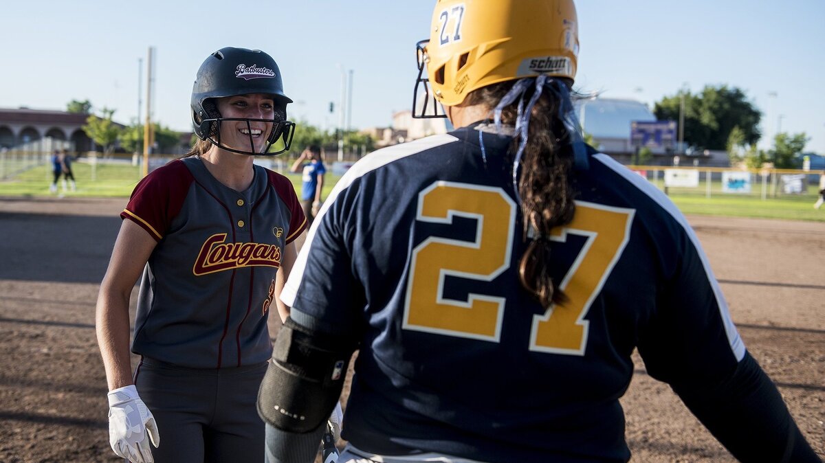 Golden Valley's Marissa Bertuccio (3) laughs with Turlock's Shelby Frutoz (27) during the annual Paul Leonardo Memorial All-Star Game at Livingston High School in Livingston, Calif., on Tuesday, June 12, 2018.