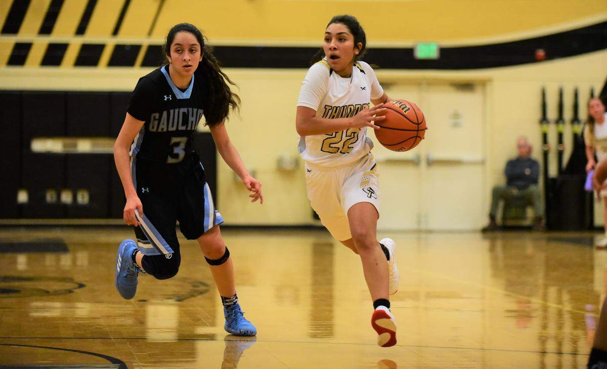 Buhach Colony’s Cassandra Gutierrez dribbles up court against El Capitan’s Daniela Belmonte during a game on Tuesday, Jan. 7, 2020.
