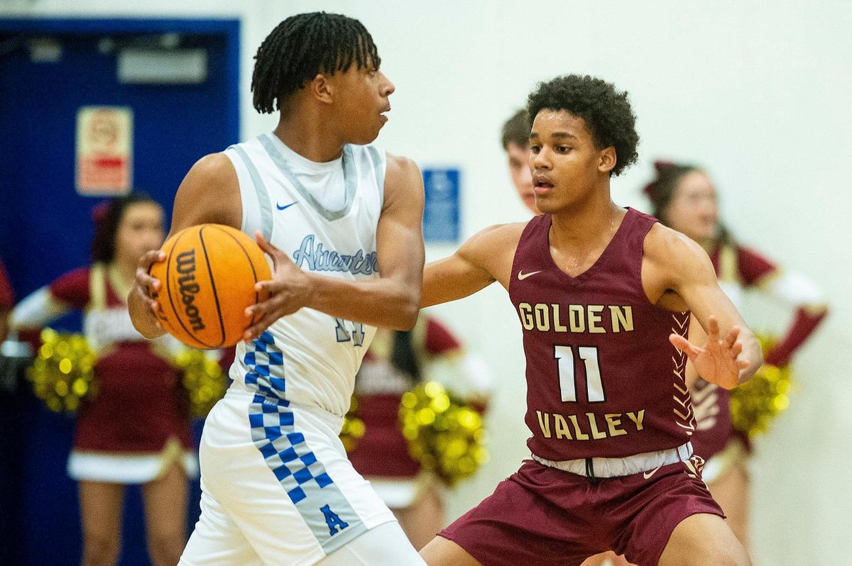 Golden Valley senior David Denson (11) guards Atwater sophomore Sylas Austin (11) during a game at Atwater High School in Atwater, Calif., on Monday, Jan. 29, 2024.