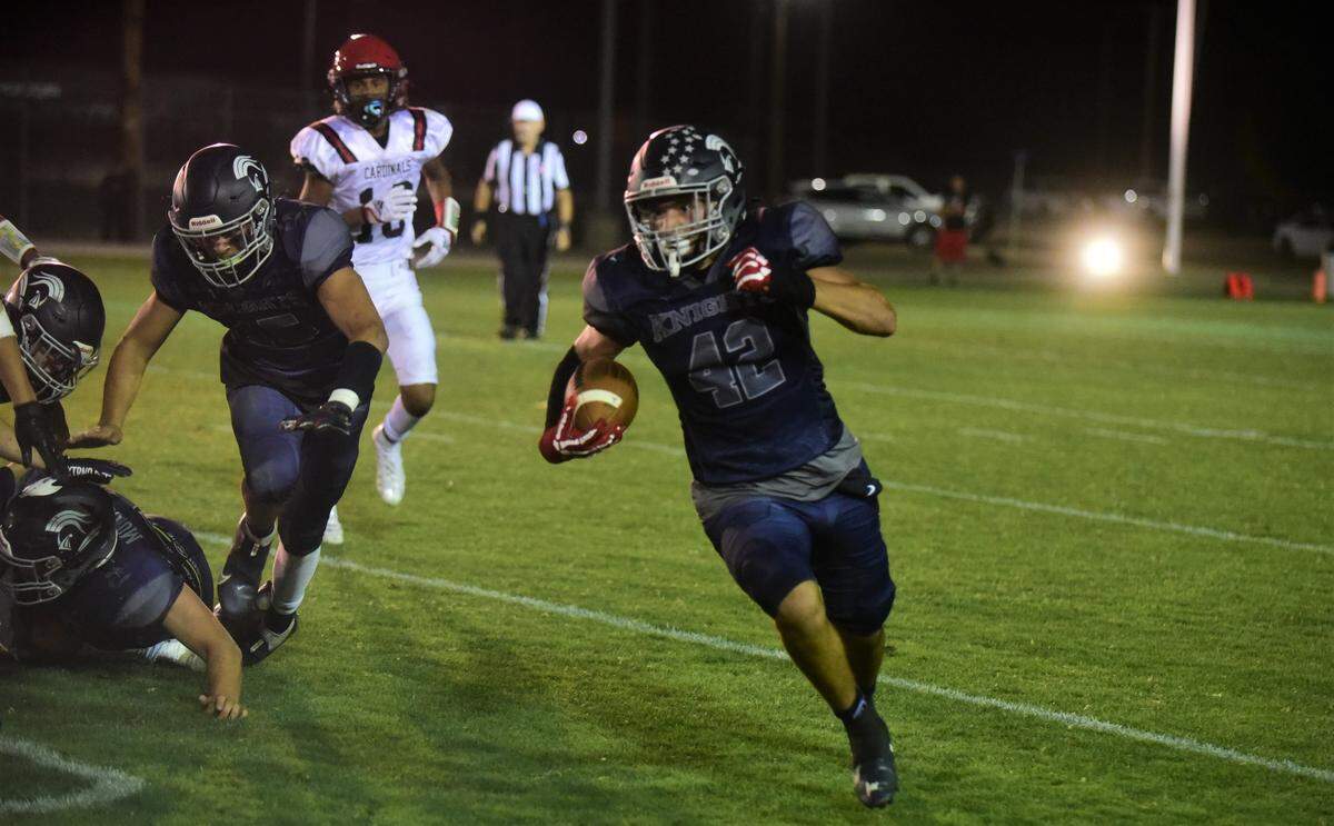 Stone Ridge Christian senior running back Hector Esquivez runs the ball during a game against Woodland Christian on Saturday, Sept. 10, 2022 at Castle Field.