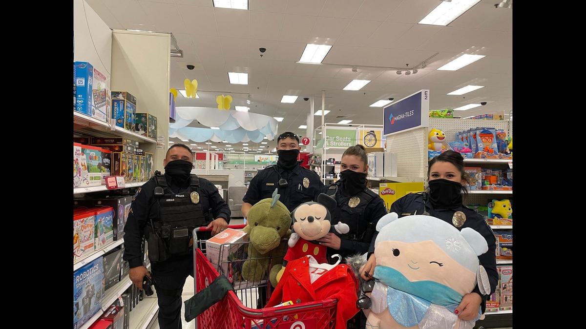 Merced police officers take part in the annual Shop With a Cop event in Merced on Thursday, Dec. 10, 2020. The event which usually sees officers and area schoolchildren shopping at the Merced Mall and surrounding area, was modified this year due to COVID-19 restrictions. This year about 20 children provided officers with a list and the officers shopped for the items and delivered them to the children. Image courtesy of Merced Police Department.