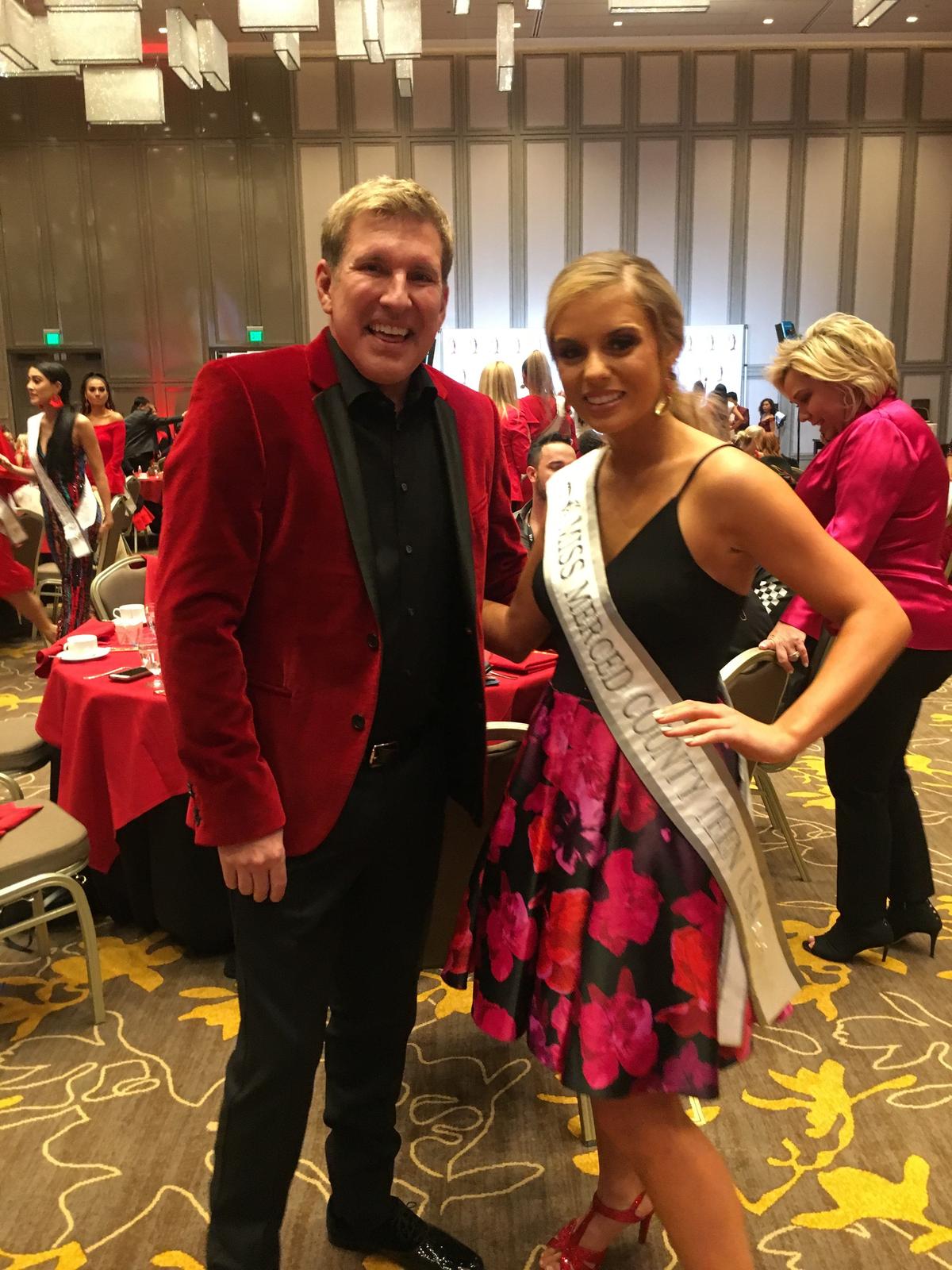 Julianna O’Banion-Borboa, a Dos Palos High School graduate and Miss Merced County Teen USA 2018, right, poses for a photo with Todd Chrisley of “Chrisley Knows Best” at a Chinese New Year dinner. O’Banion-Borboa competed for the crown of Miss California Teen USA in January. Photo courtesy of Carrie O’Banion.