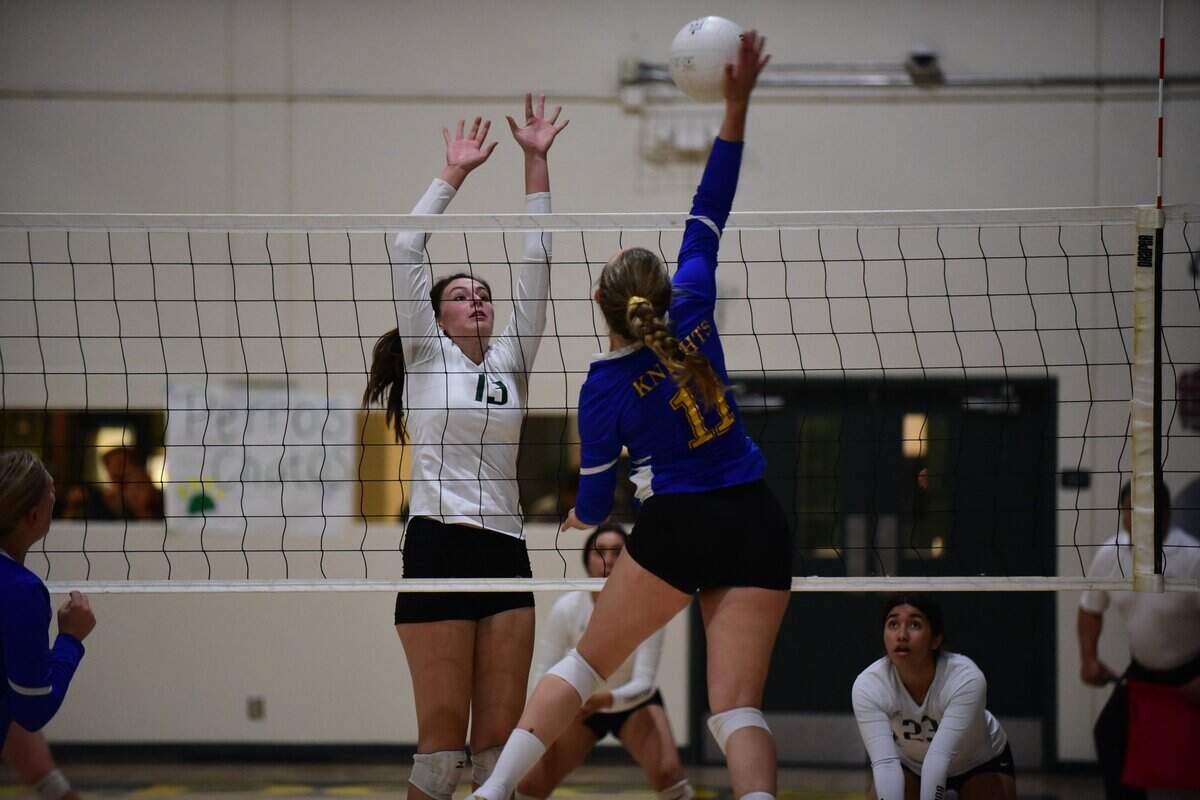 Ripon Christian’s Morgan Van Elderen attempts to hit the ball apst the block of Le Grand’s Priscilla Barnett during a playoff match on Tuesday, Nov. 5, 2019.