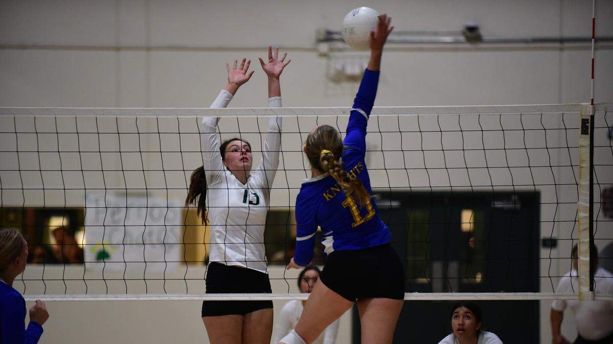 Ripon Christian’s Morgan Van Elderen attempts to hit the ball apst the block of Le Grand’s Priscilla Barnett during a playoff match on Tuesday, Nov. 5, 2019.