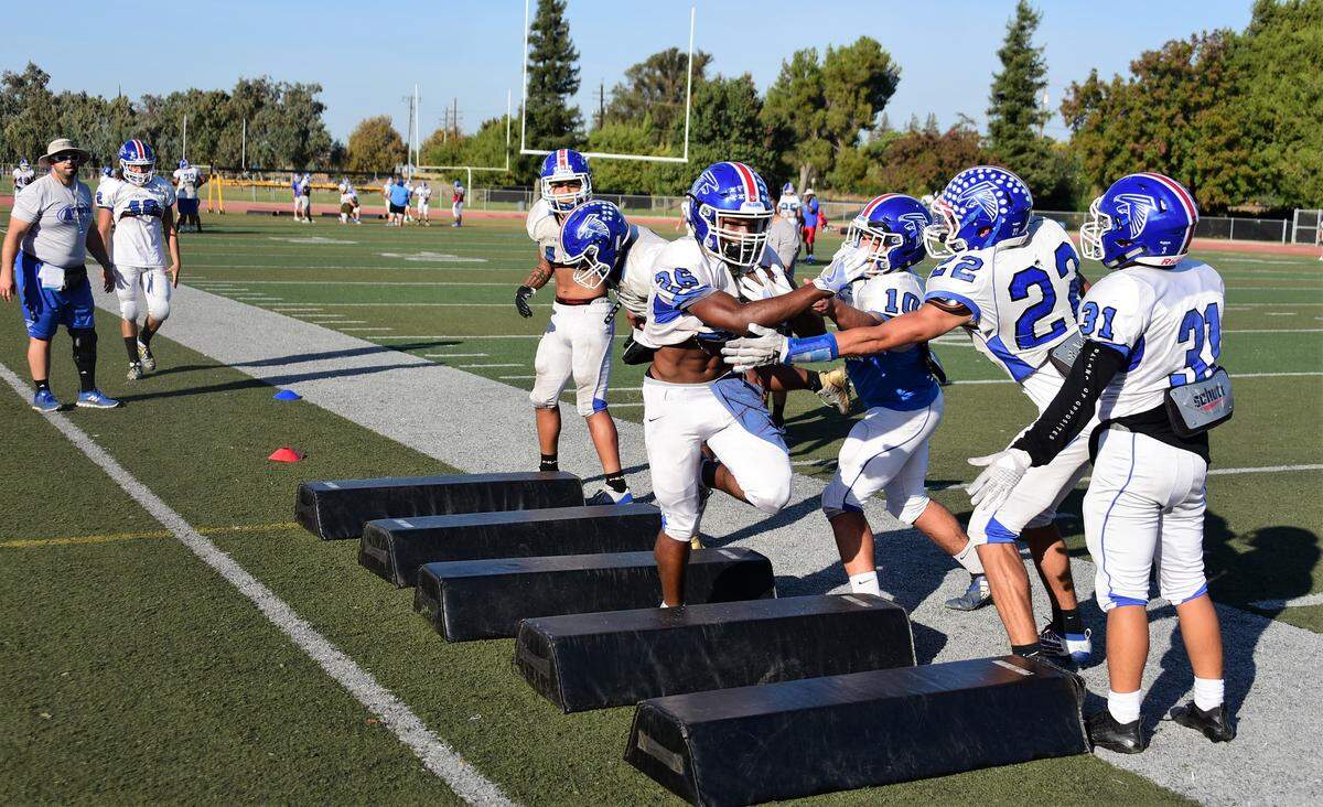 Atwater High senior Charles Jackson runs through a ball security drill during practice at Atwater High on Wednesday, Oct. 23, 2019.