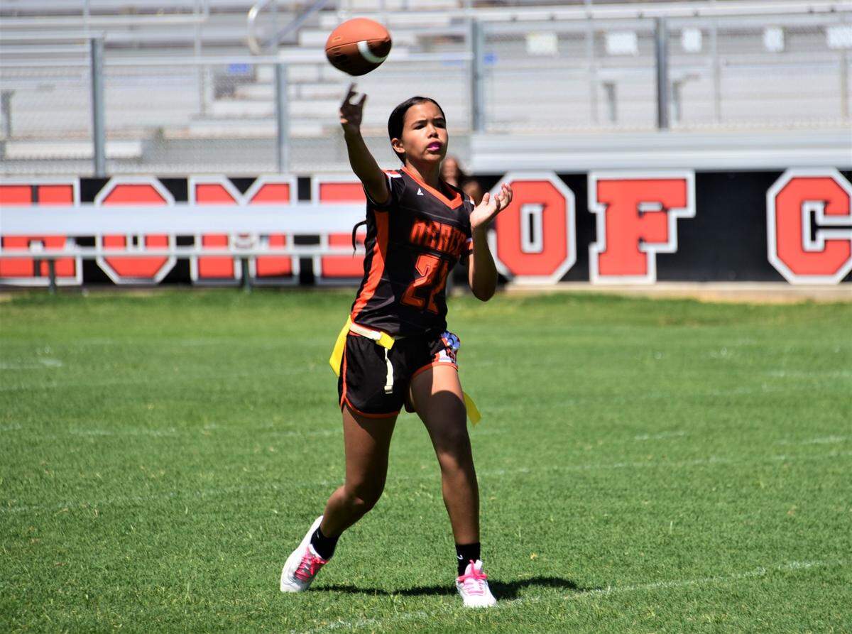 Merced High School freshman quarterback Antonia Lejarde delivers a pass during a flag football game against Atwater on Saturday, Aug. 19, 2023 at Merced High School in Merced, Calif.