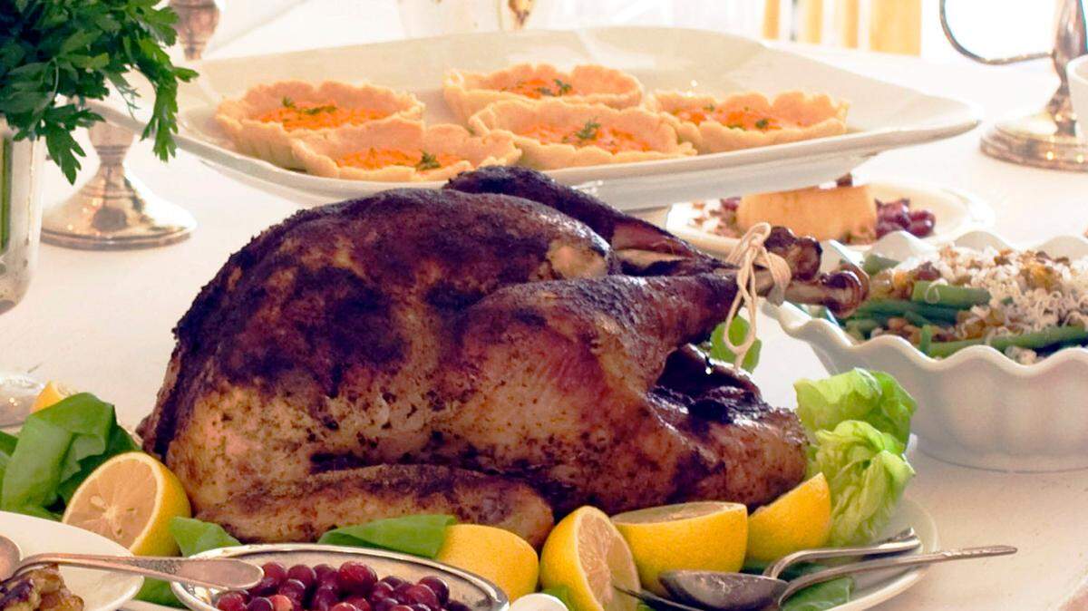 A Thanksgiving dinner is displayed on a table.