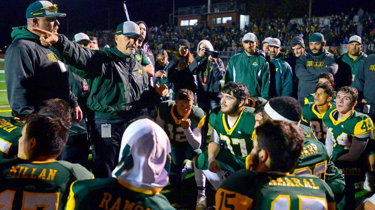 Hilmar head coach Frank Marques talks to his team after winning the Division VI CIF Sac-Joaquin championship game over Ripon Christian at Turlock High School in Turlock CA on November 30, 2018.