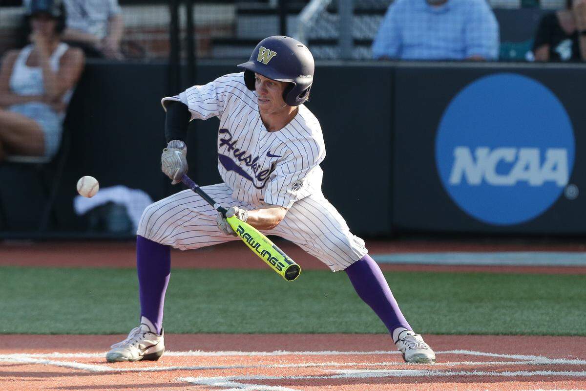 University of Washington freshman Braiden Ward attempts to bunt a pitch against Coastal Carolina in the Conway Regional of the NCAA Tournament at Springs Brooks Stadium at Coastal Carolina University in Conway, S.C. on Saturday, June 2, 2018. Zach Bland Photo