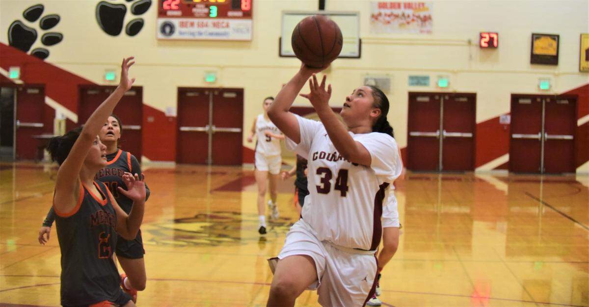Golden Valley High School junior Krystal Angel (34) goes up for a shot during a game against Merced High School on Thursday, Jan. 19, 2023 at Cougar Arena.