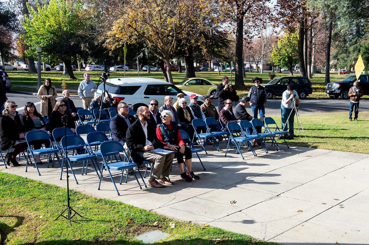 Community members and local leaders looks on during a ceremony to celebrate the start of a project to restore the exterior of the historic Merced County Courthouse Museum in Merced, Calif., on Wednesday, Dec. 11, 2024. More than $3 million in funding was secured for the restoration process which will help to maintain the building’s structural integrity and long-term sustainability. County officials said a time capsule containing various items will be buried on the property upon completion of the restoration project.