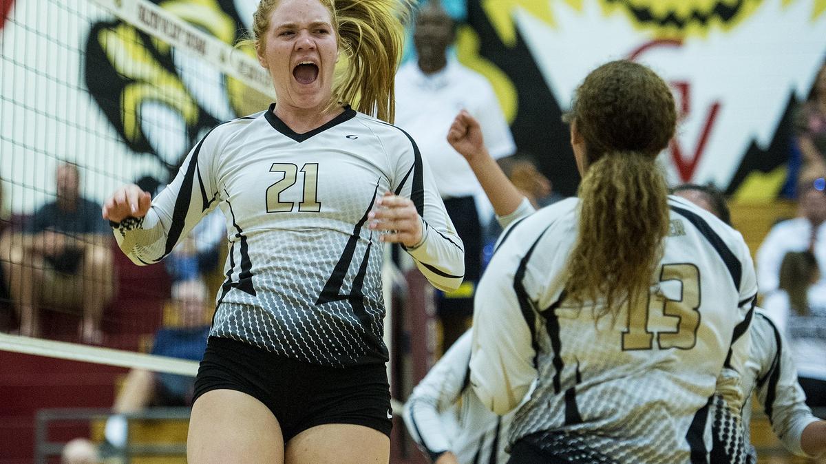 Buhach Colony senior Morgan Johnson (21) jumps in the air as she celebrates a Thunder point with teammates during a match against Golden Valley at Golden Valley High School in Merced, Calif., on Wednesday, Sept. 5, 2018. The Thunder beat the Cougars 3-0.