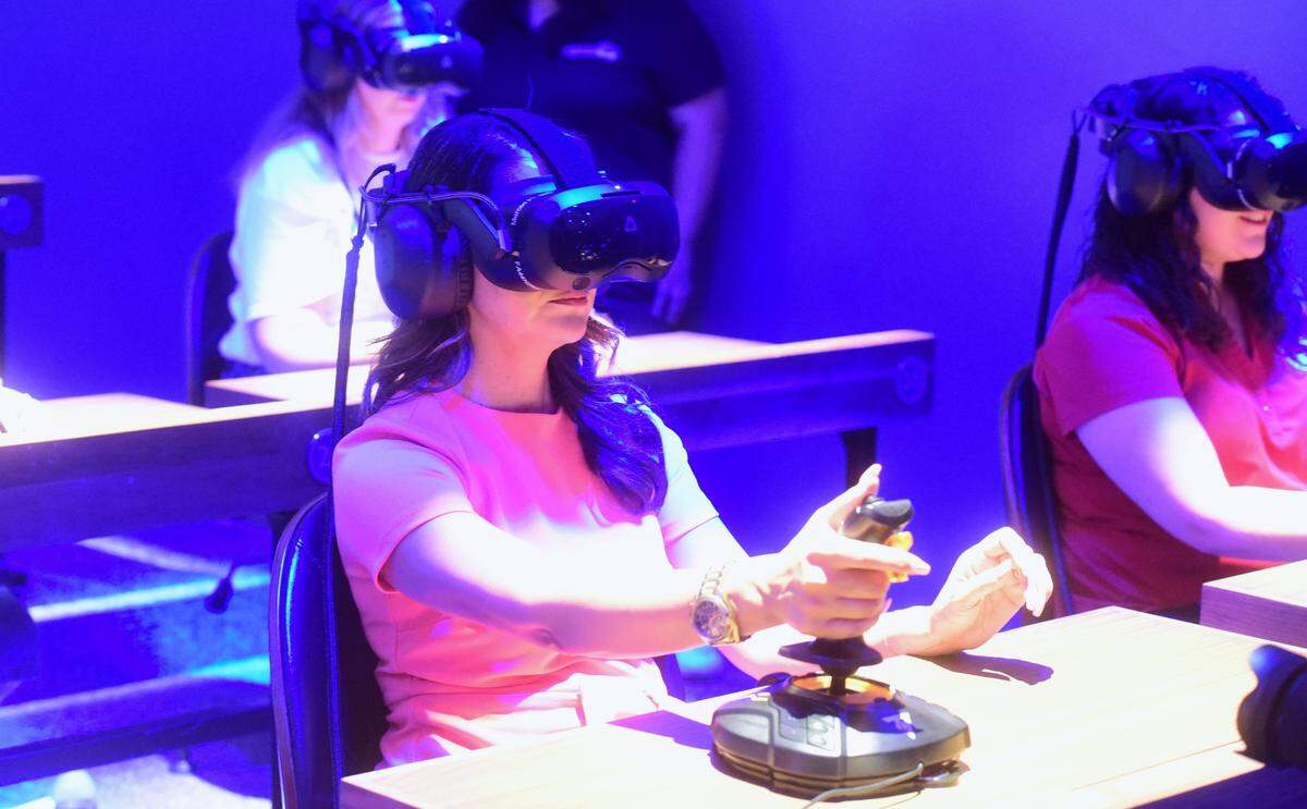 Merced City School District Superintendent Julianna Stocking tests out the new virtual reality tools at the launch of the new Dreamscape Learn Lab at Merced College in Merced, Calif. on Friday, Aug. 9, 2024.