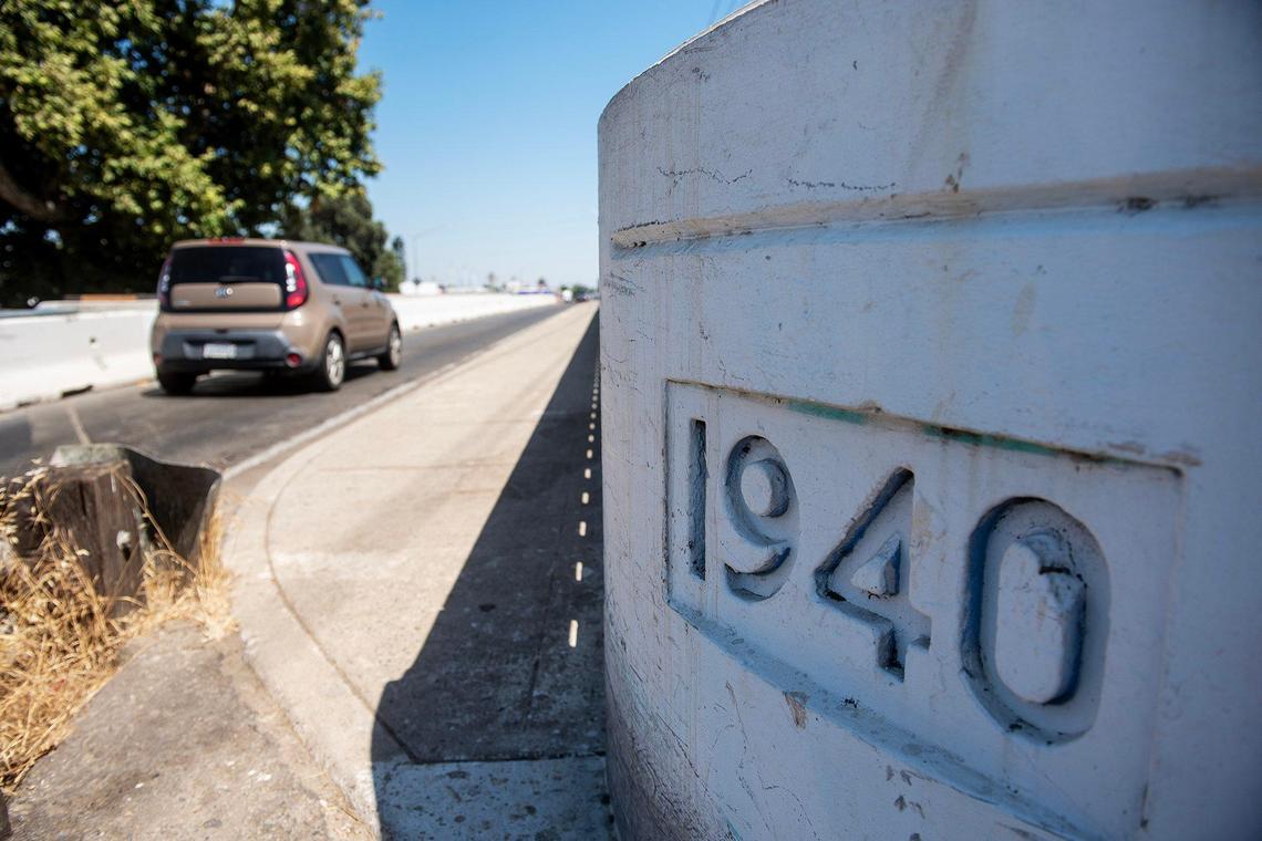 Motorists navigate a lane closure on the Bear Creek Bridge near the intersection of West 16th Street and Highway 59 in Merced, Calif., on Friday, July 18, 2025. A lane of the bridge has been closed in each direction as crews work to complete a California Department of Transportation seismic retrofit project in Merced County.