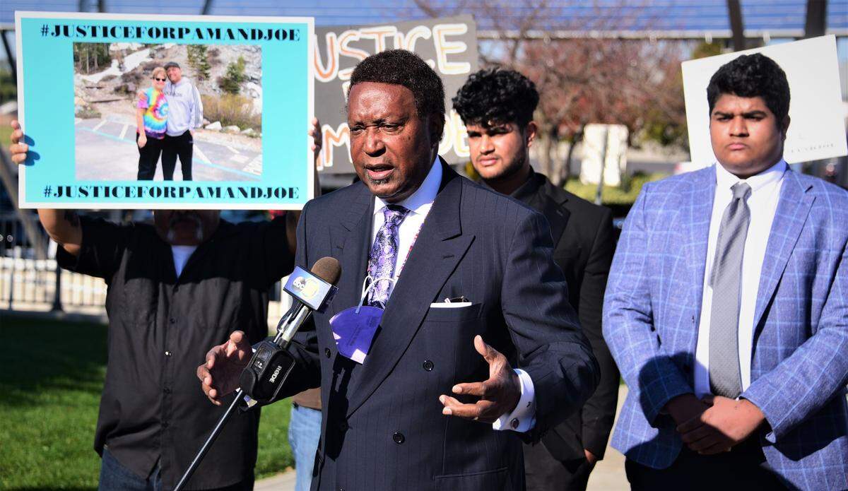 Bay Area civil rights attorney John Burris speaks during a press conference held in front of Atwater City Hall on Friday, Dec. 10, 2021 in Atwater, Calif. Burris alleges his client King Vanga (right) was falsely accused of a DUI and mistreated by Atwater police and California Highway Patrol when he was arrested on June 25 for allegedly causing the Atwater-area crash that killed husband and wife Jose Juarez and Pamela Juarez.