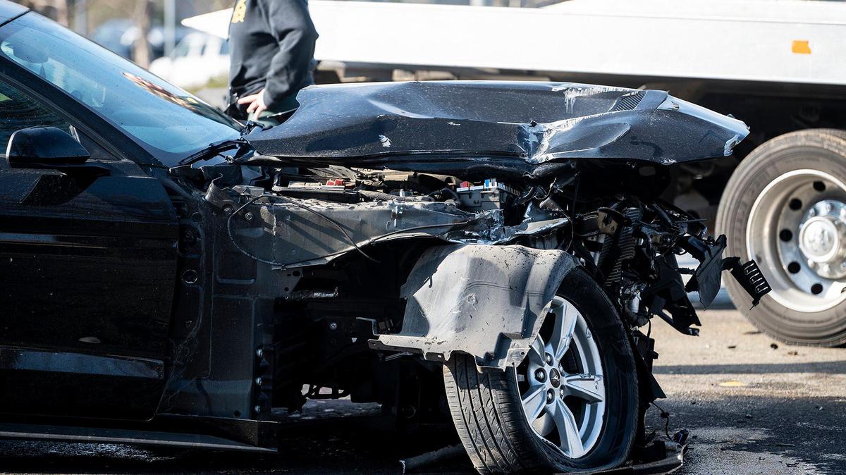 Police respond to the scene of a collision involving a vehicle and train on M Street in Merced, Calif., on Wednesday, Feb. 1, 2023. According to police, the 65-year-old driver was not injured when the vehicle rolled forward and collided with the passing freight train.