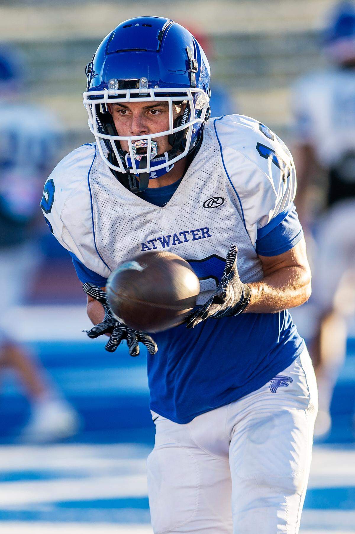 Landon Perez catches a pass during football practice at Atwater High School in Atwater, Calif., on Wednesday, Aug. 14, 2024.