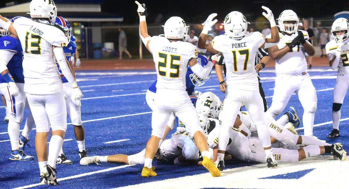 The Hilmar High defense reacts after recovering an Atwater fumble during a game on Friday, Sept. 13, 2024 at Dave Honey Stadium.