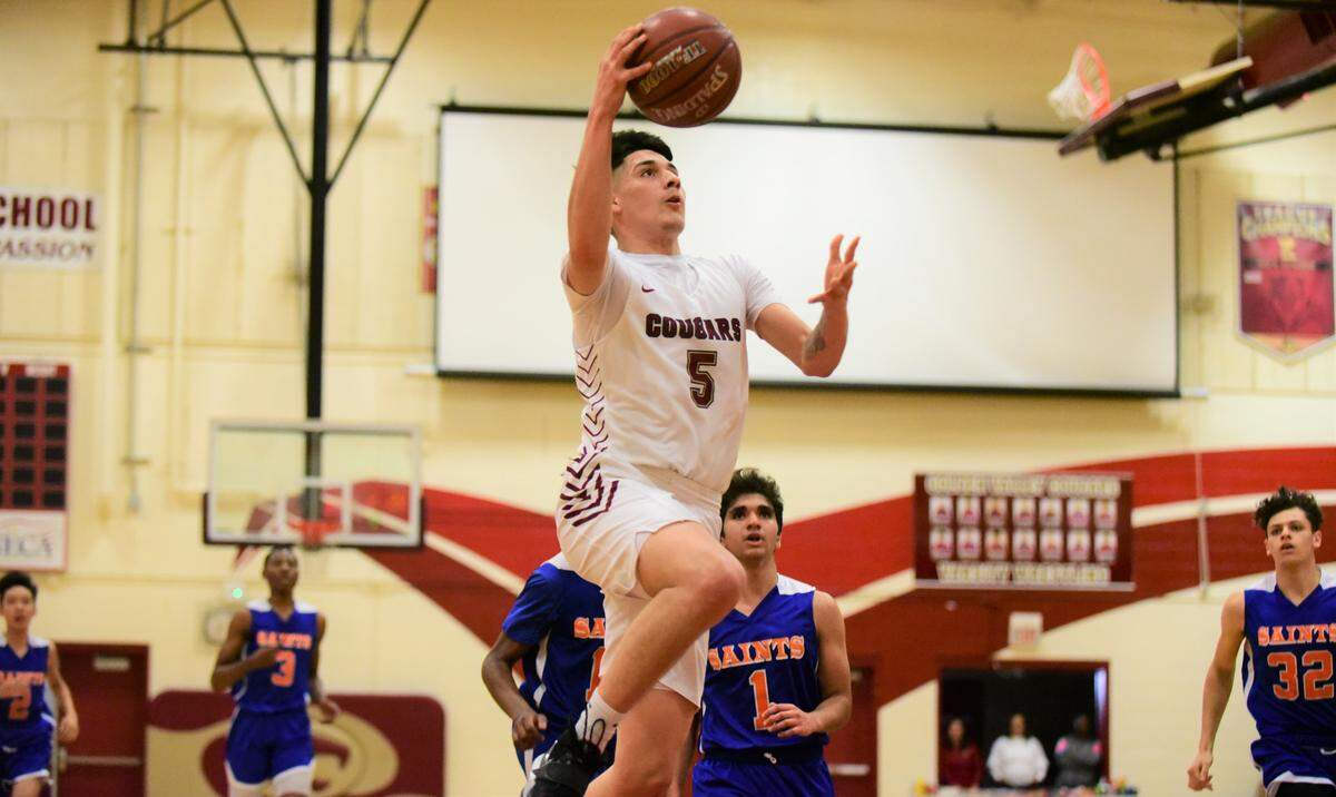 Golden Valley High senior Christian Magallanes goes up for a layup against Santa Teresa during the Northern California Regional Division IV playoff game at Cougar Arena on Tuesday, March 3, 2020 in Merced, Calif.