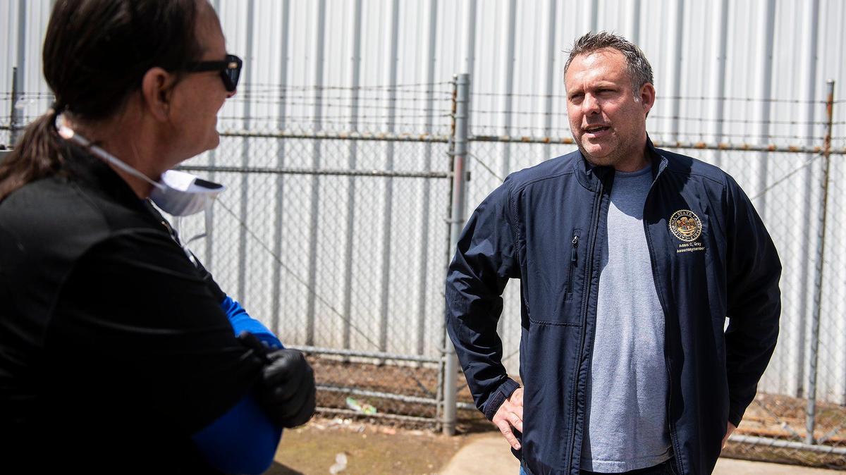 Assembly member Adam Gray, D-Merced, right, speaks with Medallion Wellness CEO Michael O’Leary, left, as O’Leary and Medallion Wellness drop off a donation of gloves and sanitizing wipes at the Merced County Department of Public Health last April.