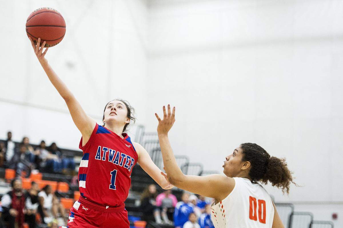 Atwater junior Kelsey Valencia (1) attempts a layup during a game against Merced at Merced High School in Merced, Calif., on Tuesday, Jan. 16, 2018. The Bears beat the Falcons 68-51.