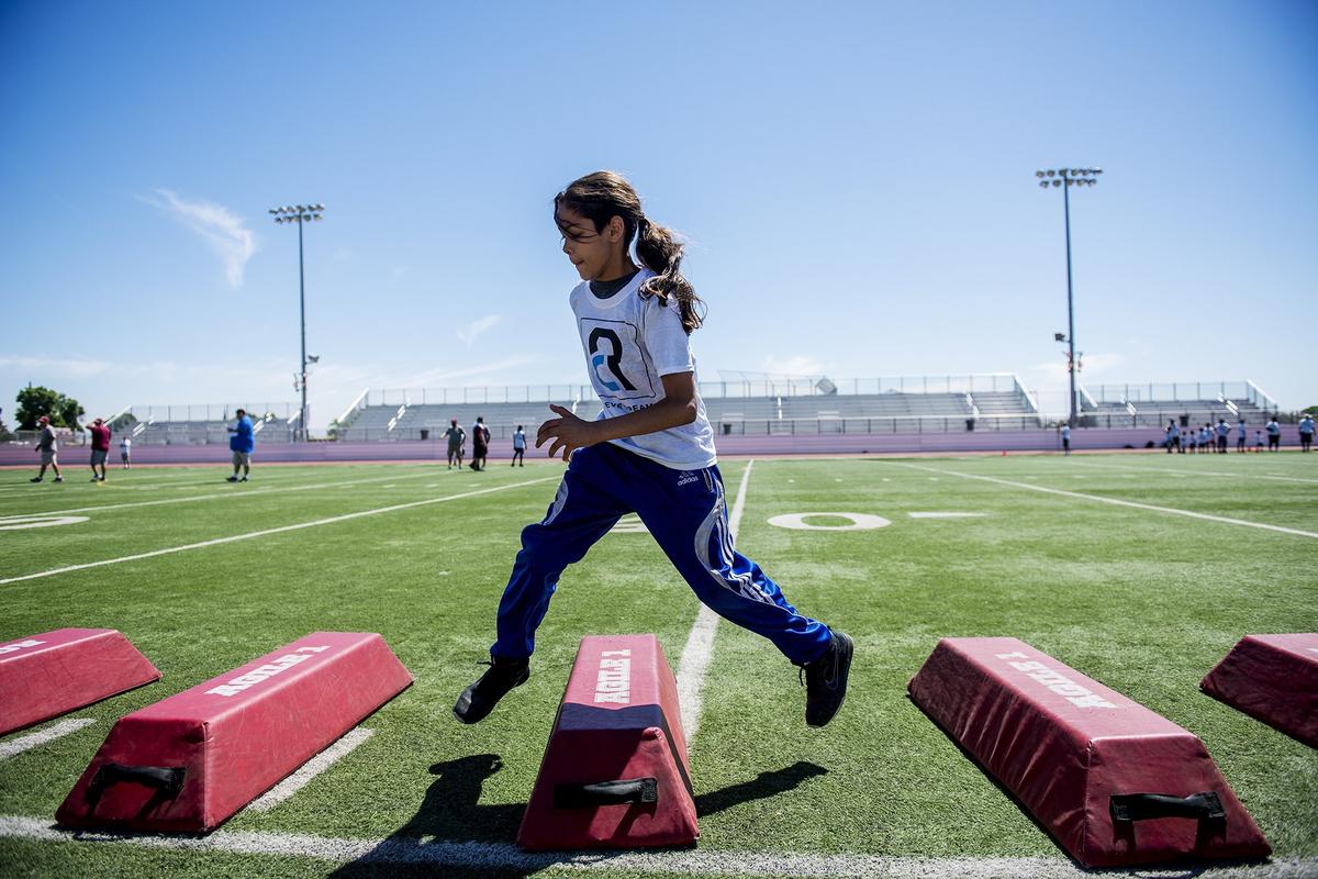 Damian Manzo, 11, of Merced, completes footwork drills during the Achieve Dreams Youth Football Camp at Veterans Stadium on the campus of Golden Valley High School in Merced, Calif., on Saturday, May 12, 2018. The camp is hosted by Golden Valley graduate and Canadian Football League all-star Chris Randle. This is the second year Randle has hosted the camp which is offered free of charge to children ages 6-18.