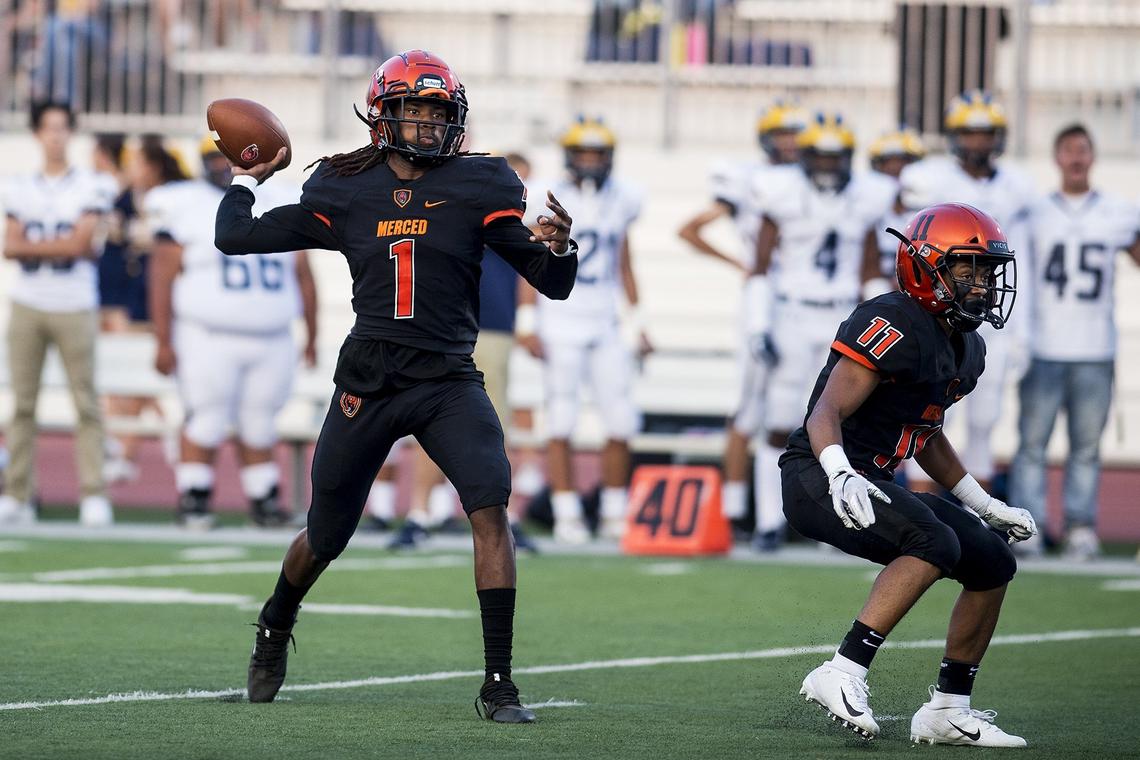 Merced senior quarterback Dhameer Warren (1) drops back to pass during a game against Gregori at Veterans Stadium on the campus of Golden Valley High School in Merced, Calif., on Friday, Aug. 24, 2018. The Bears beat the Jaguars 41-22.