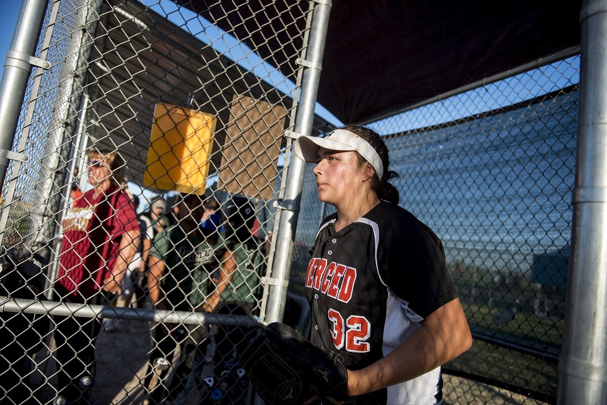 Merced's Abby Flores (32) leaves the dugout to pitch during the annual Paul Leonardo Memorial All-Star Game at Livingston High School in Livingston, Calif., on Tuesday, June 12, 2018.