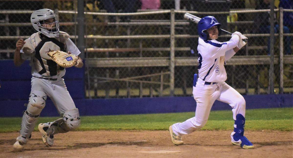 Atwater High’s Xavier Cardenas watches as he hits a two-run double during the sixth inning in a 5-1 win over Merced on Friday, April 29, 2022 at Memorial Ballpark in Atwater, Calif.