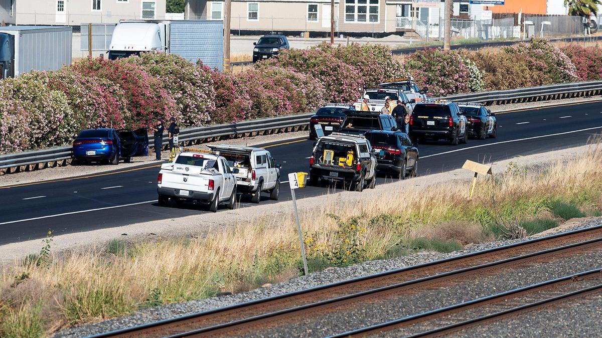 The California Highway Patrol investigates the scene of a fatal shooting on southbound Highway 99 just south of Franklin Road in Merced County, Calif., on Tuesday, June 15, 2021.