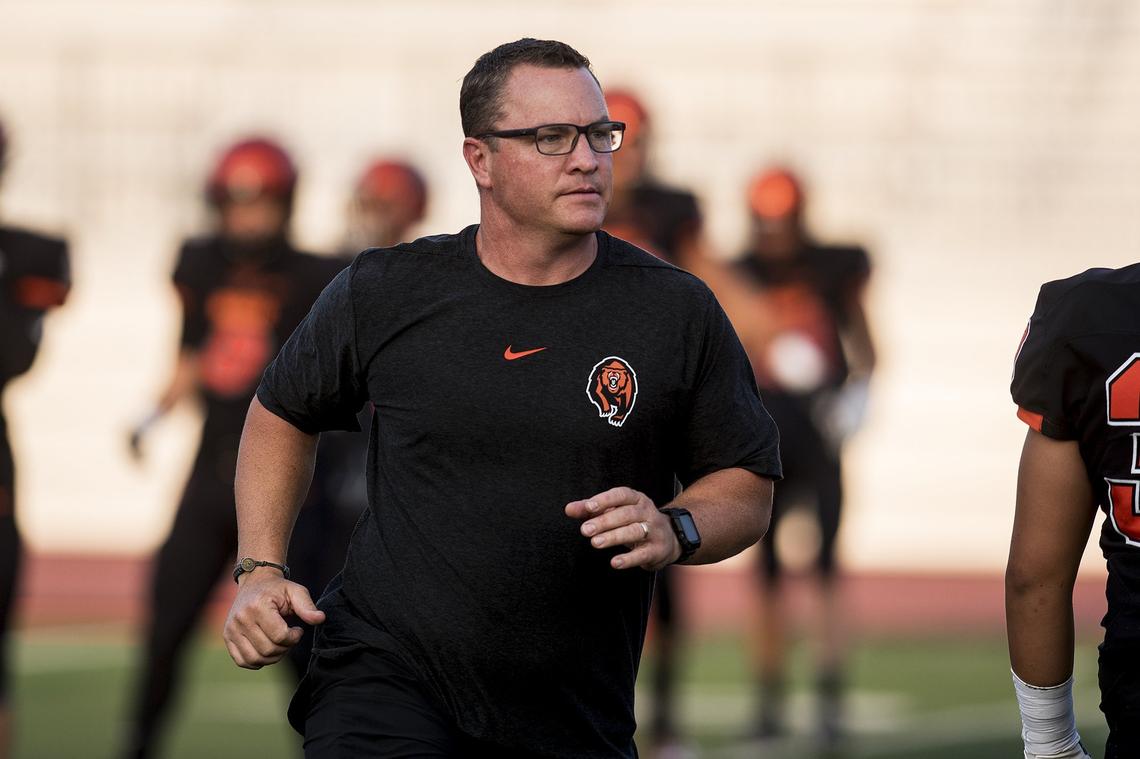 Merced head coach Rob Scheidt jogs across the field before a game against Gregori at Veterans Stadium on the campus of Golden Valley High School in Merced, Calif., on Friday, Aug. 24, 2018. The Bears beat the Jaguars 41-22.