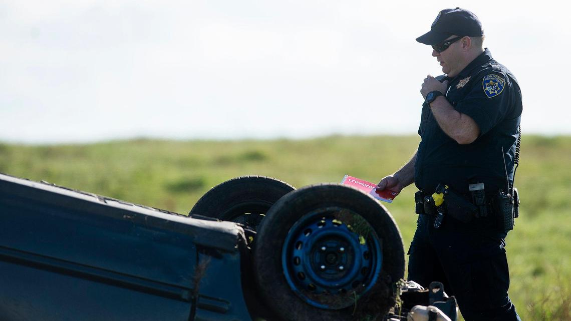 The California Highway Patrol and rescue crews respond to the scene of a solo-vehicle rollover collision in the area of Snelling Road and East Youd Road in Merced County, Calif., on Sunday, March 29, 2020.