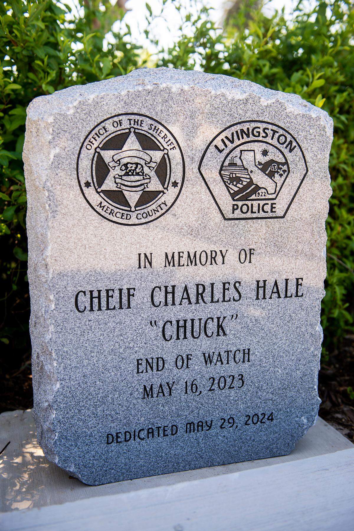 A memorial stone in memory of former Livingston Police Chief and Merced County Sheriff’s Deputy Charles “Chuck” Hale is unveiled during the annual Merced County Peace Officers Memorial Ceremony in Merced, Calif., on Wednesday, May 29, 2024.