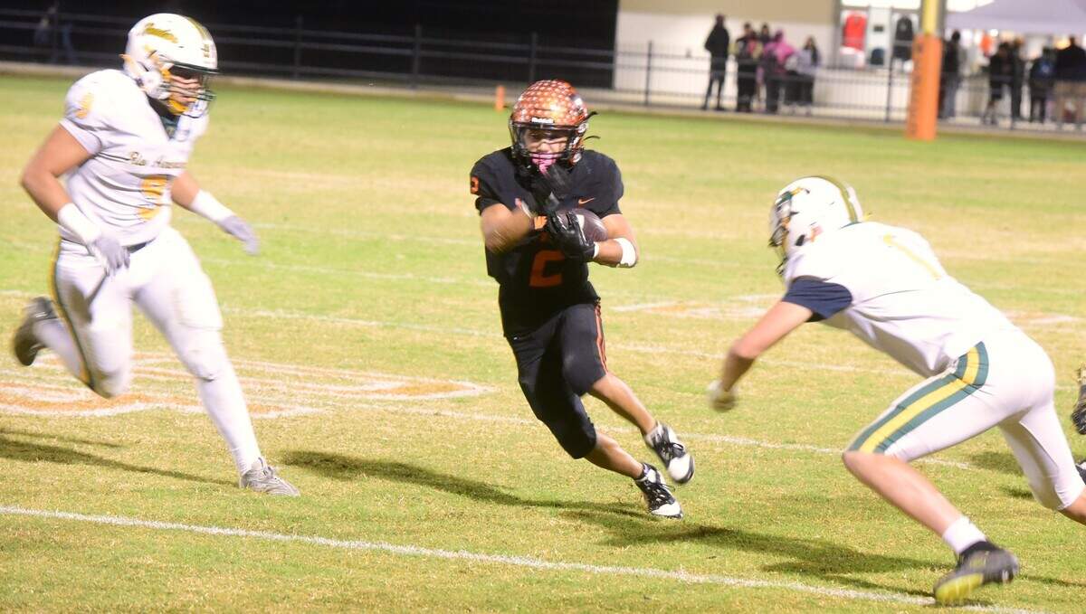 Merced High running back Adarius Morales-Saetern (2) runs the ball during a playoff game against Rio Americano on Friday, Nov. 8, 2024 at Cathie Hostetler Stadium in Merced, Calif.
