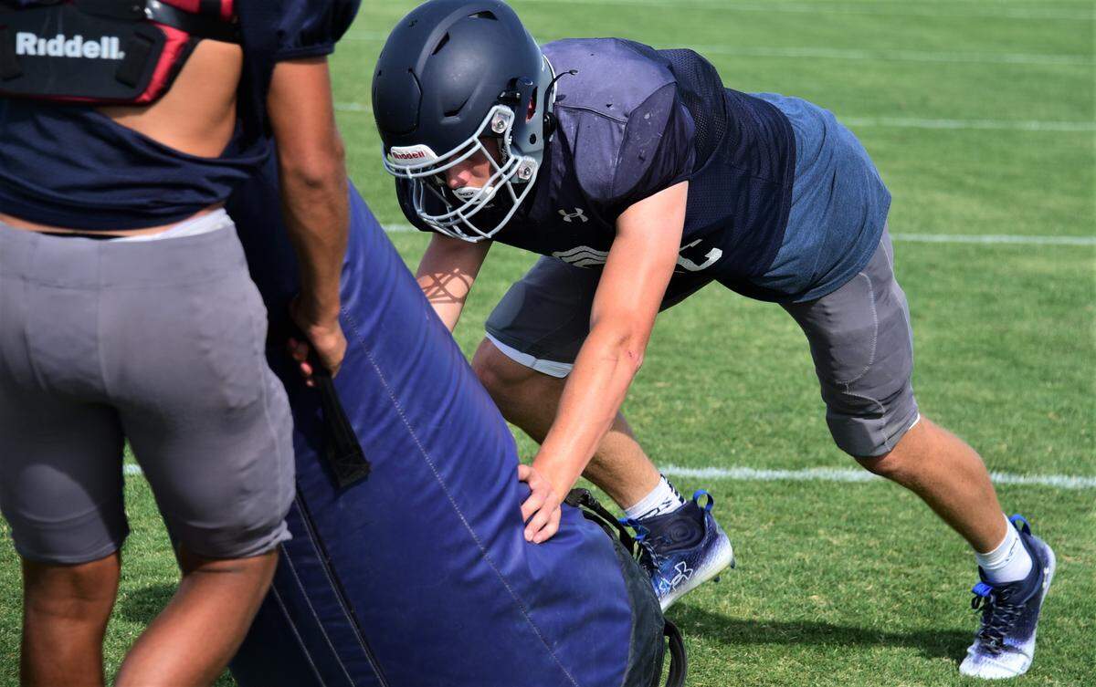Stone Ridge Christian High School senior Max Friedman works on blocking technique during practice on Tuesday, Aug. 2, 2022 at Castle Field. Friedman will be an impact player for the Knights this season on both sides of the ball.