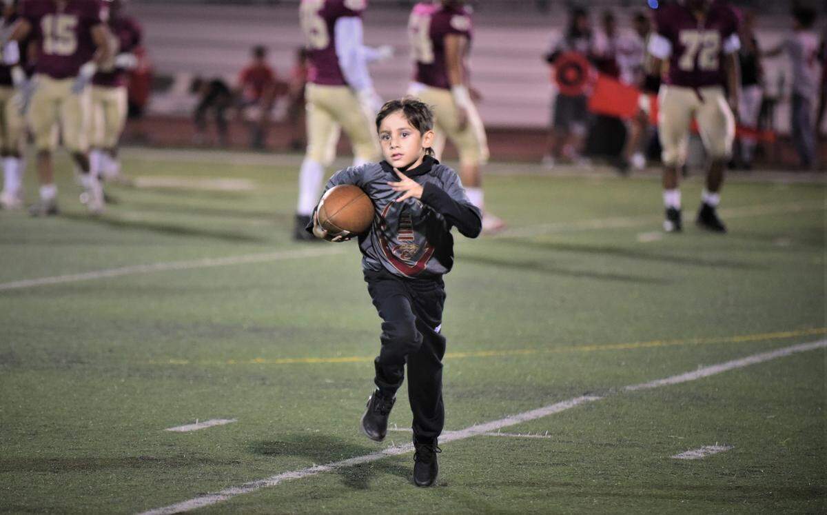 Ricky Martinez, 8, served as the Golden Valley football ball boy against Chowchilla on Friday, Sept. 3, 2021, just four days after being involved in a scary car crash with his father Ricky and two younger brothers.