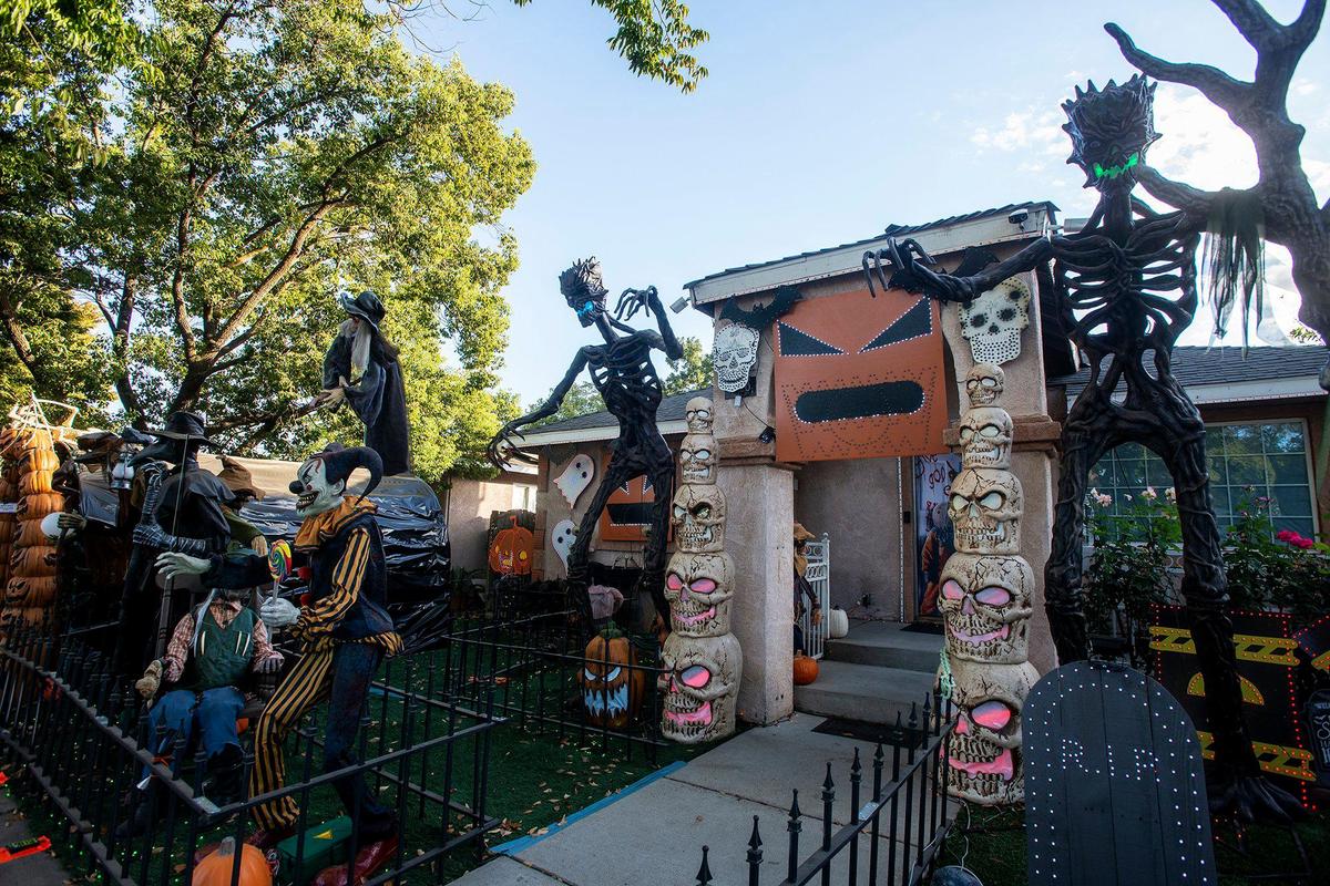 Halloween decorations fill the yard of Miguel Avila, 28, at his home on West 9th Street in Merced, Calif., on Thursday, Oct. 17, 2024.