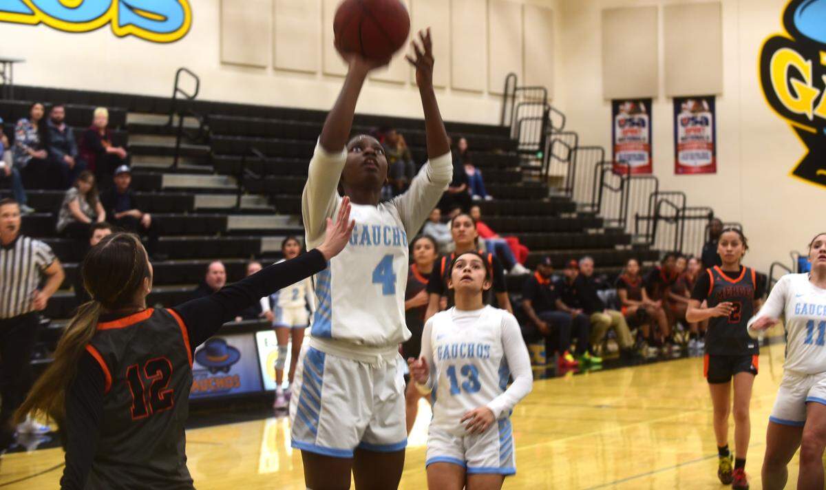 El Capitan High School sophomore Jordynn Middleston (4) goes up for a basket during th Gauchos’ 58-44 win over Merced on Thursday, Jan. 4, 2024.