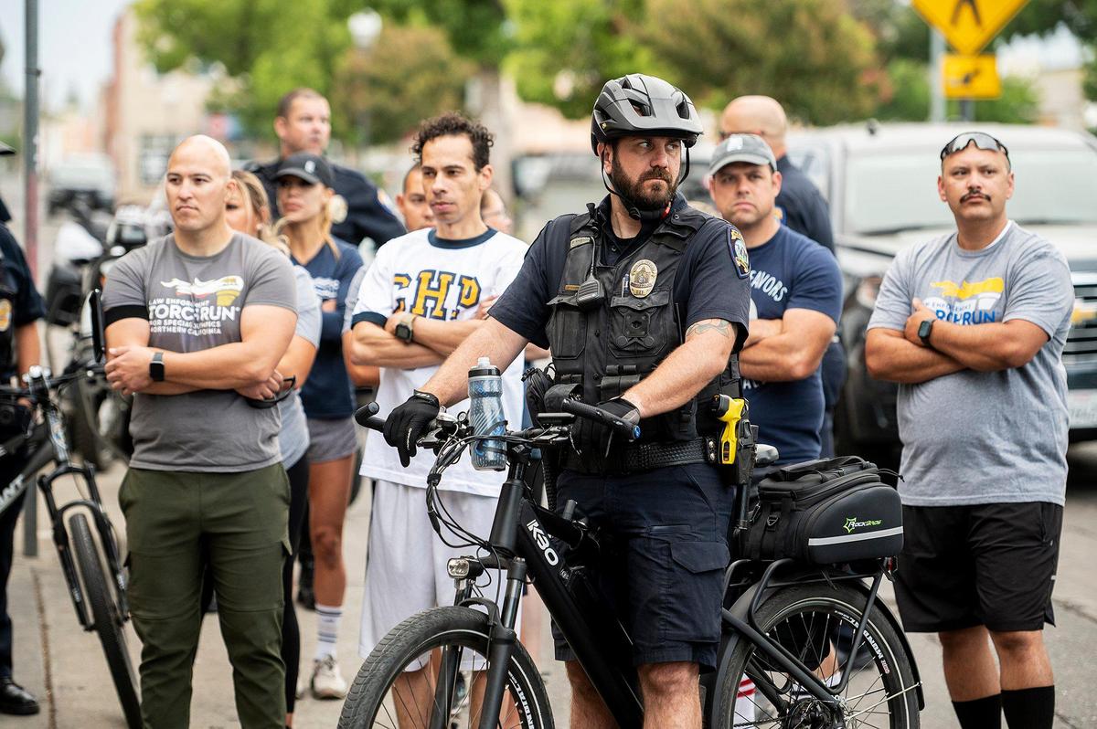 Merced County law enforcement officers gather prior to the start of the Law Enforcement Torch Run for Special Olympics Northern California in Merced, Calif., on Wednesday, June 22, 2022. This year marks the 25th anniversary of the Law Enforcement Torch Run for the Special Olympics Northern California.