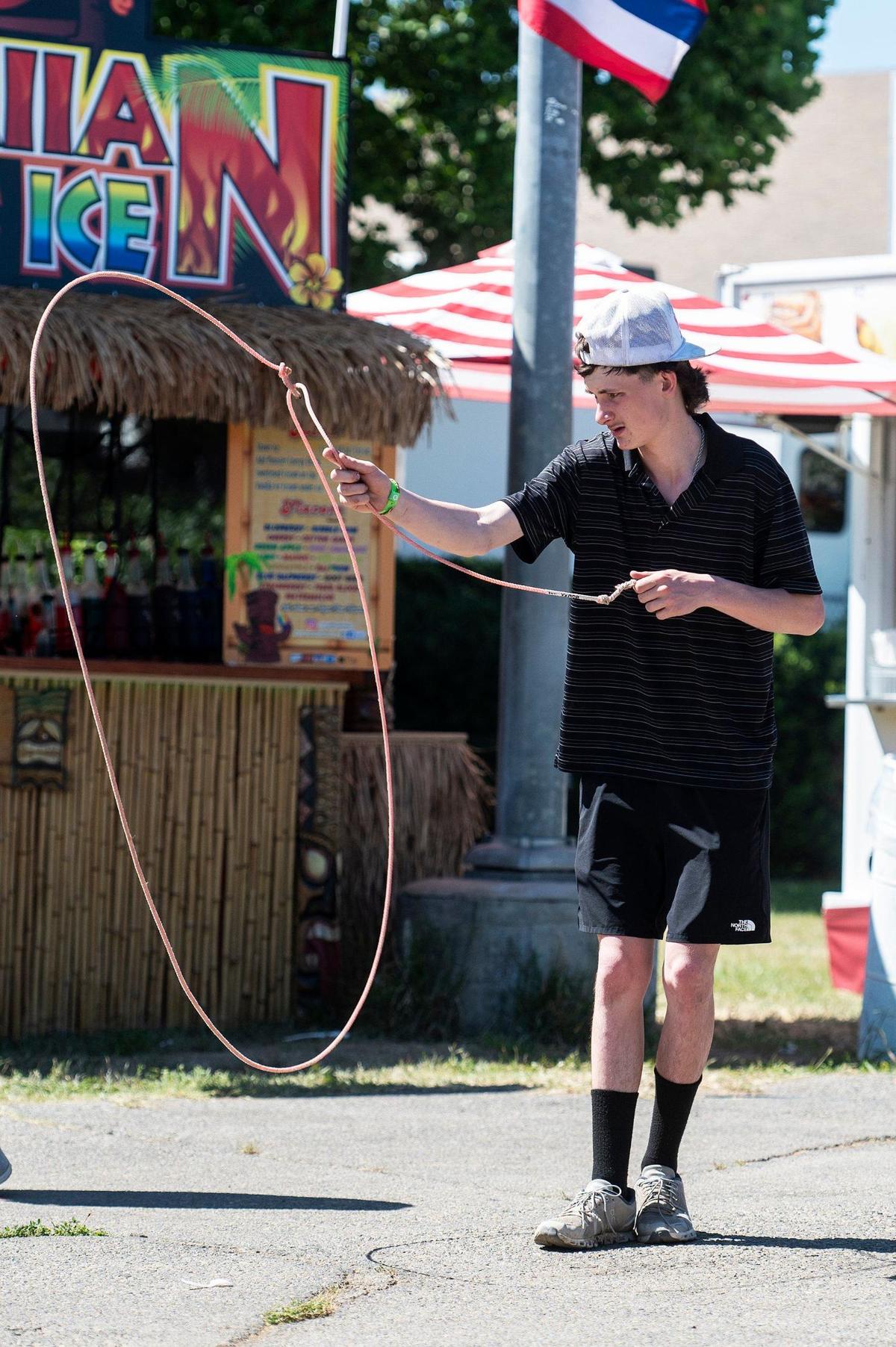 Los Banos FFA member Teagan Strohmenger spins a lasso at the Merced County Fair in Merced, Calif., on Thursday, June 6, 2024.