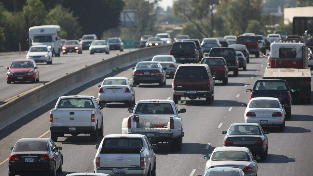 A steady stream of cars and trucks fill Highway 99.