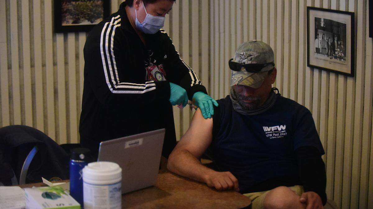Los Banos veteran William Winch, 51, receives a COVID-19 vaccination during an open house held at the Veterans Hall in Los Banos, Calif. on Saturday, Nov. 20, 2021.