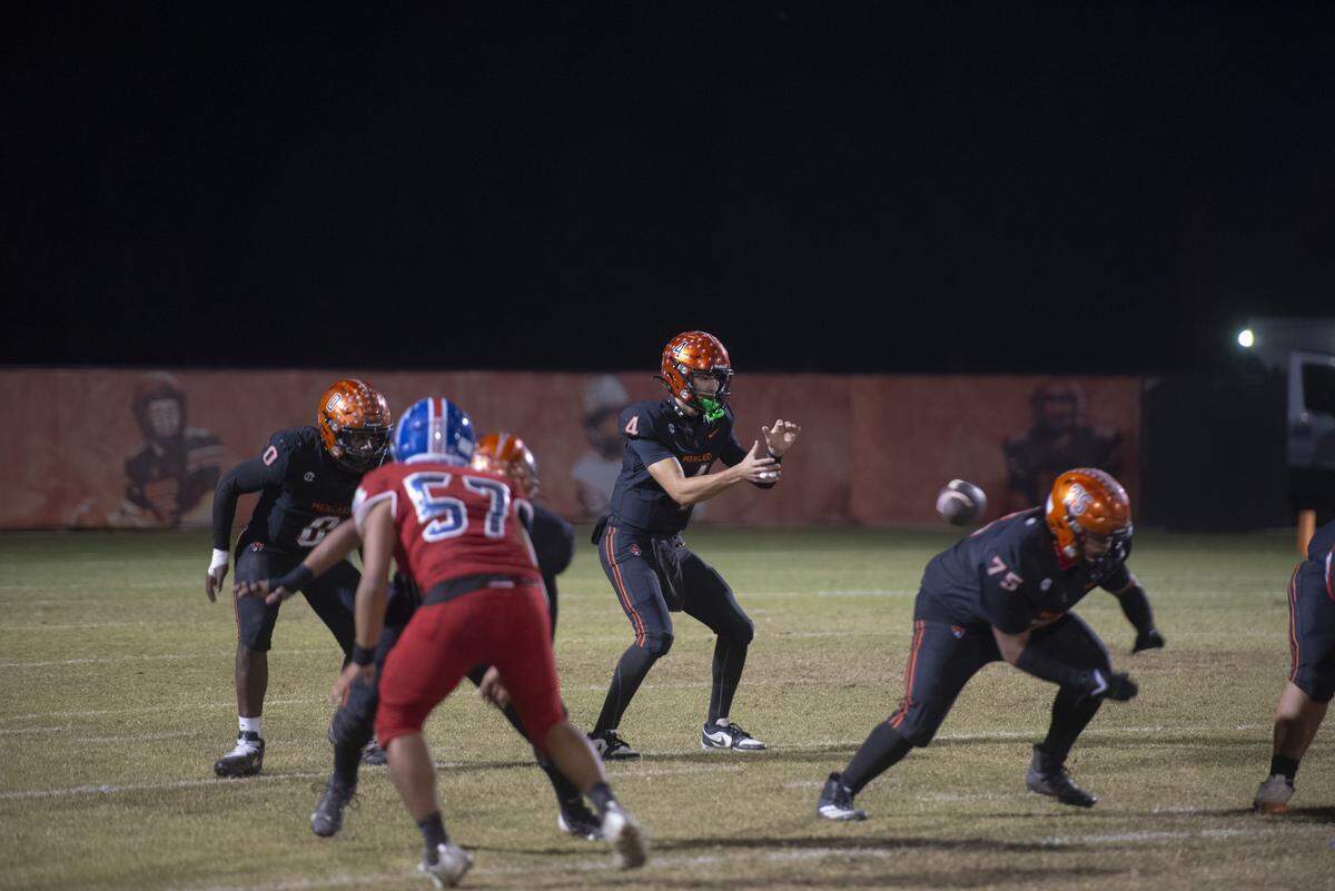 Merced High quarterback Vicente Cortez (4) sets for the snap in the first half of the Bears’ 49-14 win over Atwater at Merced High on Friday, Oct. 24, 2025.