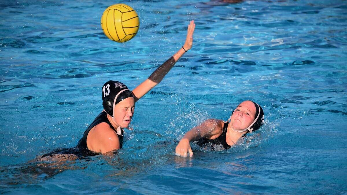 Buhach Colony senior Syndey Abril fires a shot as her sophomore sister Kyley Abril defends her during practice on Thursday, Oct. 28, 2021 at Buhach Colony High School.