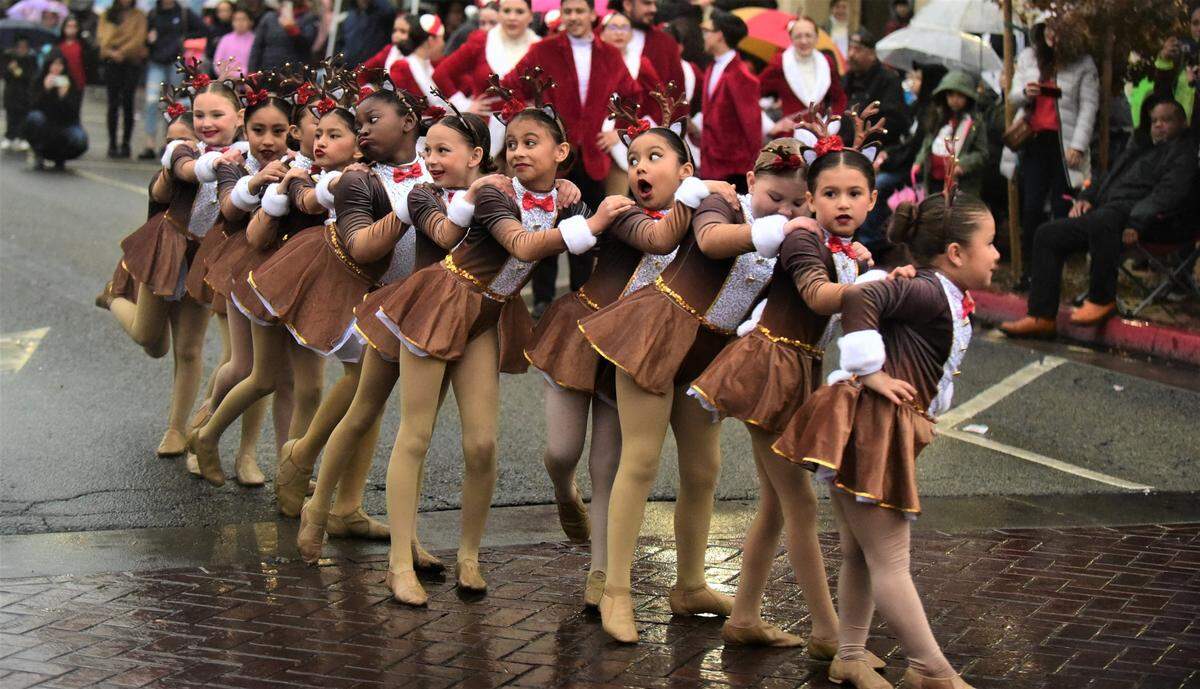 Members from Studio K dance studio perform in front of Bob Hart Square during the Merced Christmas Parade on Saturday, Dec. 3, 2022.