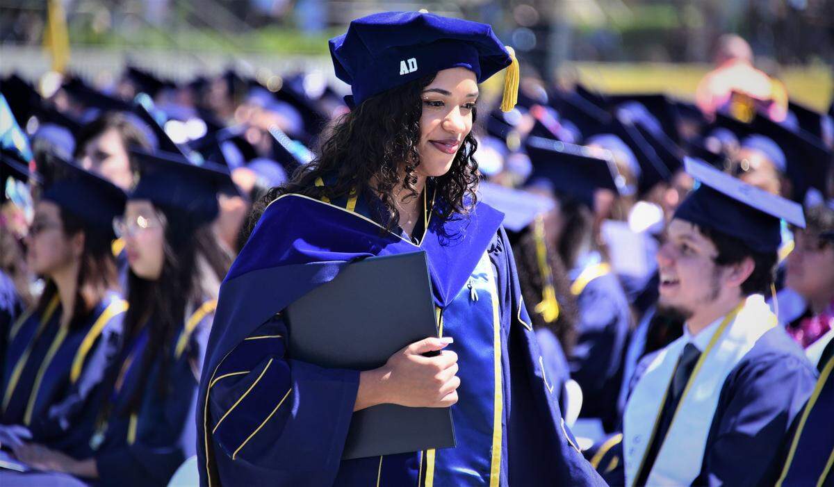 UC Merced graduate Janice Disla receives her doctorate degree during the UC Merced Graduation Ceremony on Saturday, May 14, 2022 at UC Merced in Merced, Calif.